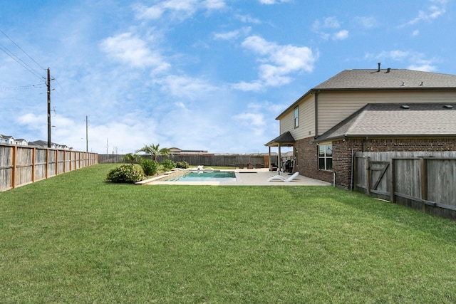 view of yard with a fenced backyard, a patio, and a fenced in pool