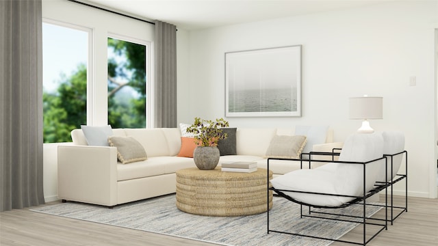 living room featuring light wood finished floors and baseboards