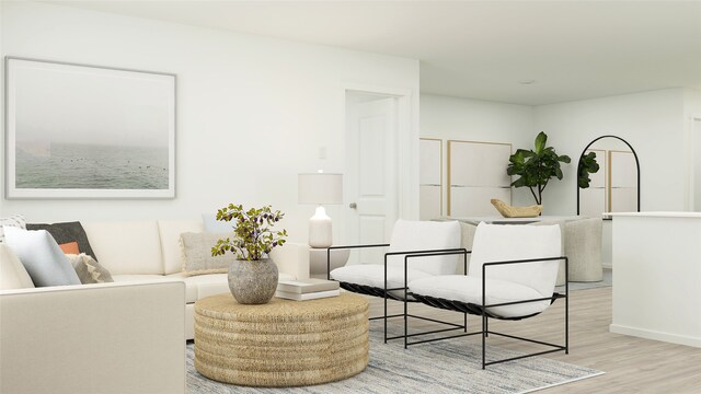 living area with light wood-style floors and baseboards