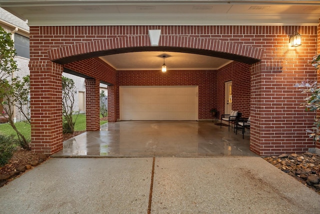 garage with driveway and visible vents
