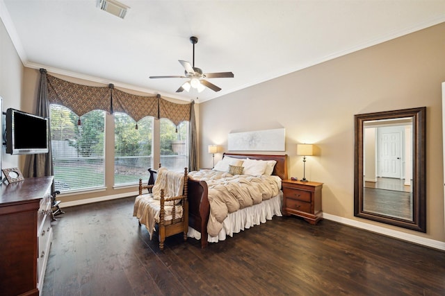 bedroom featuring crown molding, baseboards, visible vents, and wood finished floors