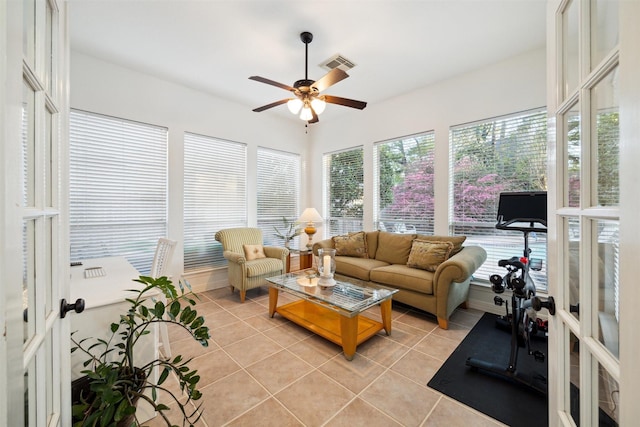 sunroom / solarium with tile patterned floors and visible vents