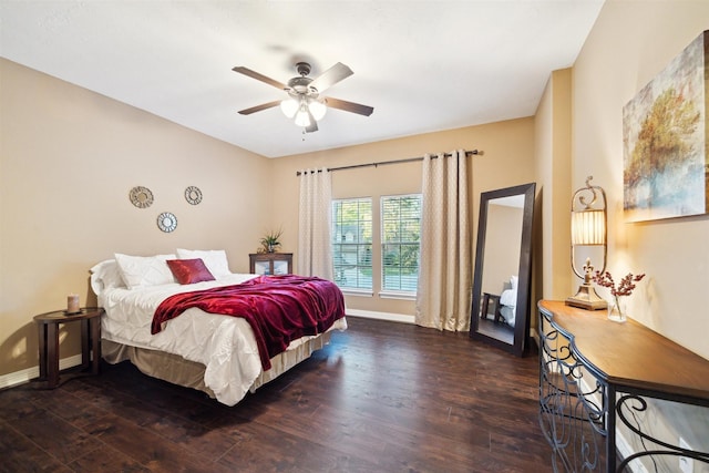 bedroom with baseboards, a ceiling fan, and wood finished floors