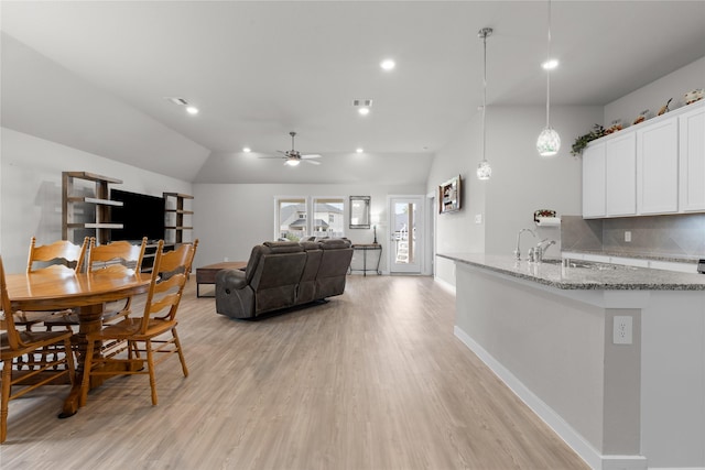 119 Comber Rd, Magnolia, TX 77354 - dining space featuring visible vents, baseboards, a ceiling fan, lofted ceiling, and light wood-style floors