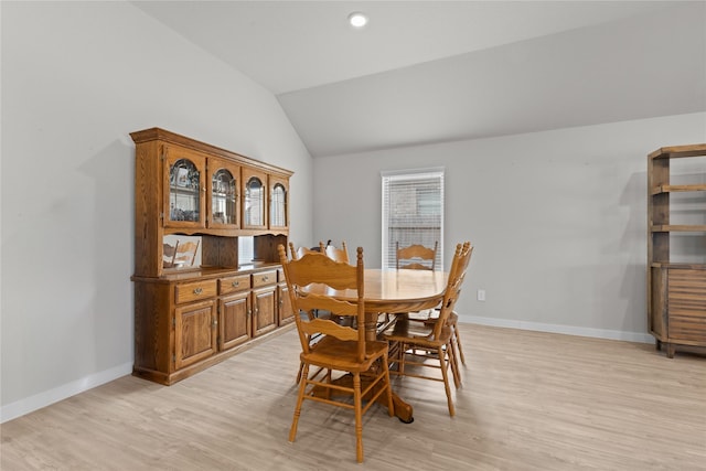 119 Comber Rd, Magnolia, TX 77354 - dining area featuring baseboards, vaulted ceiling, and light wood-style floors