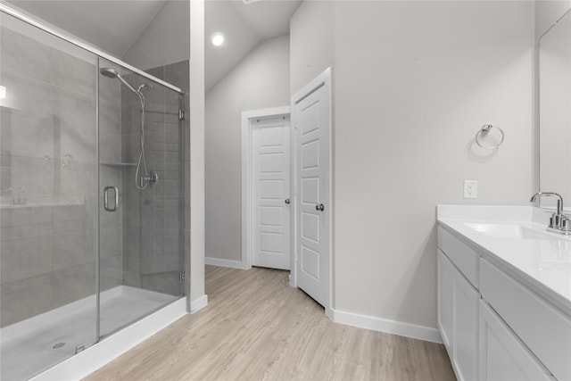 119 Comber Rd, Magnolia, TX 77354 - full bath with vanity, lofted ceiling, baseboards, a stall shower, and wood finished floors