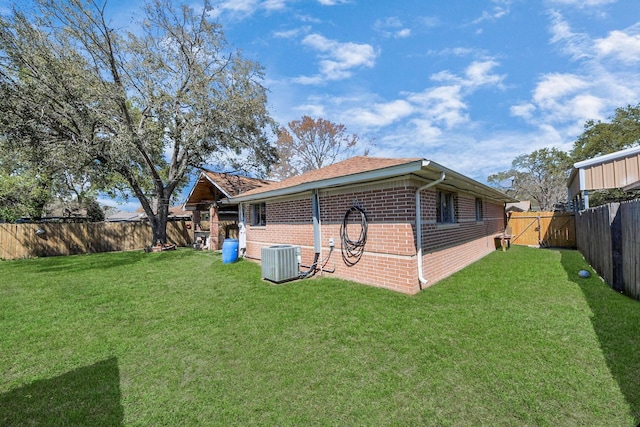 9926 Caffrey St, Houston, TX 77075 - rear view of property featuring brick siding and cooling unit