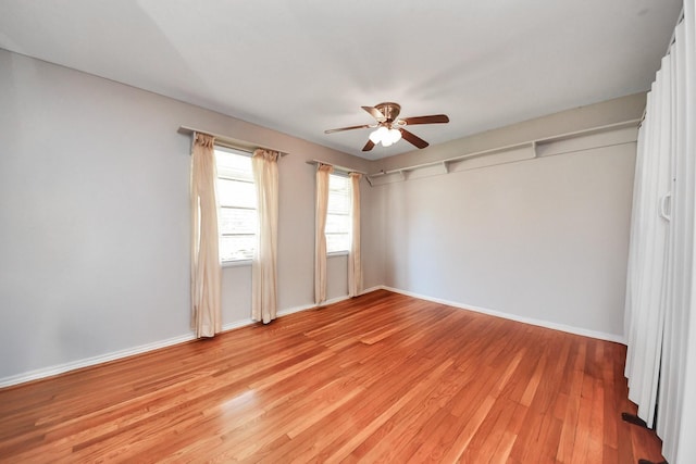 9926 Caffrey St, Houston, TX 77075 - unfurnished bedroom with light wood finished floors, baseboards, and ceiling fan