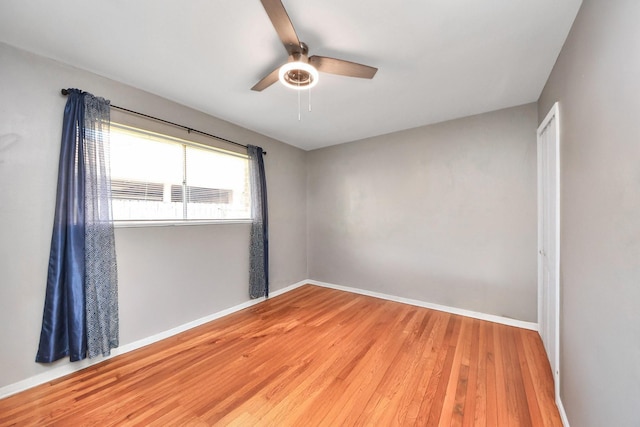 9926 Caffrey St, Houston, TX 77075 - empty room with a ceiling fan, wood finished floors, and baseboards