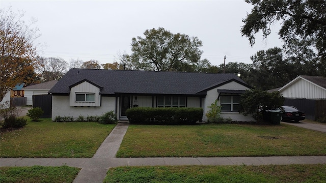 5535 Spellman Rd, Houston, TX 77096 - single story home with a front lawn, brick siding, and a shingled roof