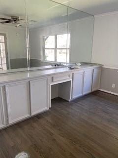 5535 Spellman Rd, Houston, TX 77096 - kitchen with light countertops, white cabinetry, ceiling fan, and dark wood-style flooring