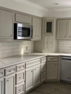 5535 Spellman Rd, Houston, TX 77096 - kitchen featuring stainless steel appliances, gray cabinets, ornamental molding, and tasteful backsplash