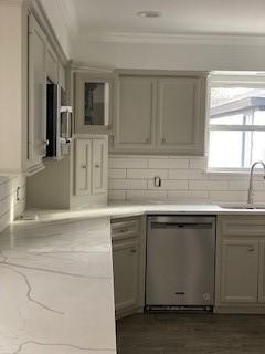 5535 Spellman Rd, Houston, TX 77096 - kitchen featuring light countertops, stainless steel dishwasher, gray cabinets, and a sink