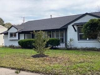 5535 Spellman Rd, Houston, TX 77096 - ranch-style house featuring a front lawn