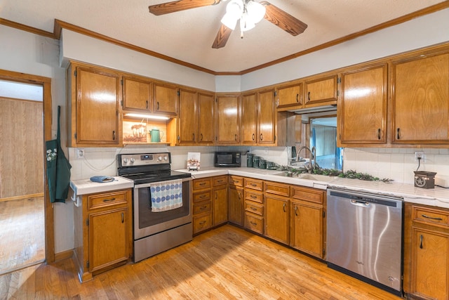 kitchen with a ceiling fan, light wood finished floors, brown cabinets, stainless steel appliances, and tasteful backsplash