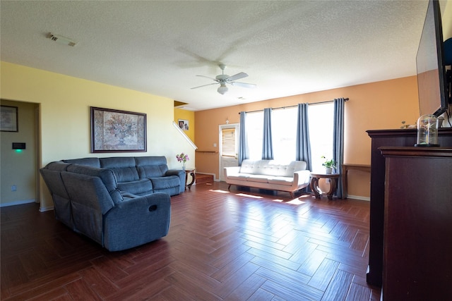 18531 Grove Brook Ln, Cypress, TX 77429 - living area with a ceiling fan, baseboards, and a textured ceiling