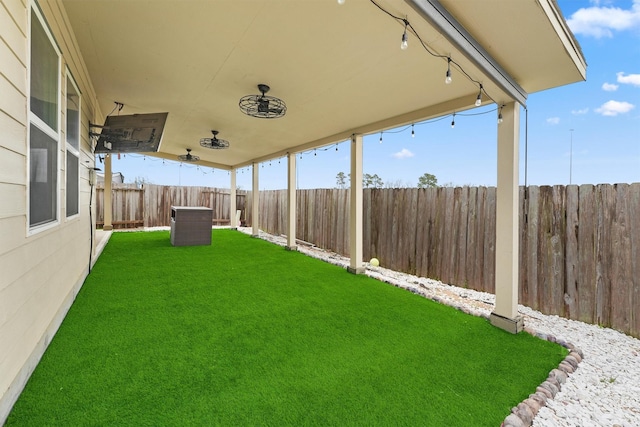 view of yard with a fenced backyard