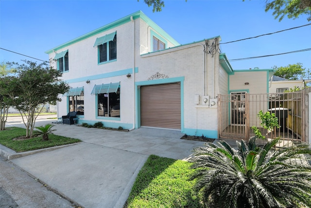 2102 Avenue N Ave N, Galveston, TX 77550 - view of front of home with driveway, a gate, and fence