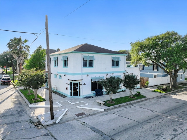 2102 Avenue N Ave N, Galveston, TX 77550 - view of front of property with stucco siding and fence
