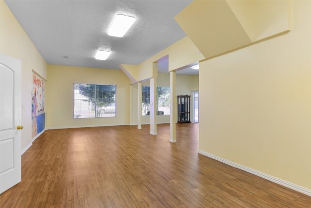 2102 Avenue N Ave N, Galveston, TX 77550 - unfurnished room featuring baseboards, wood finished floors, and a textured ceiling