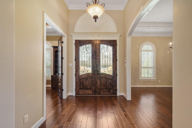 33922 High Point Dr, Magnolia, TX 77355 - entryway with arched walkways, wood-type flooring, ornamental molding, and french doors
