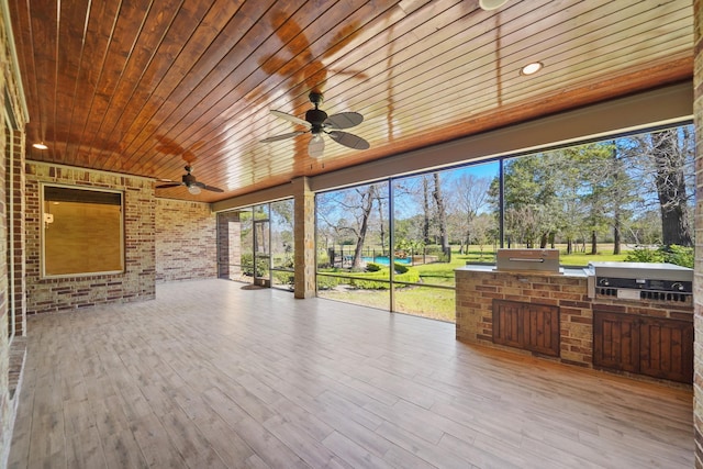 33922 High Point Dr, Magnolia, TX 77355 - view of patio featuring a ceiling fan, area for grilling, and view of wooded area