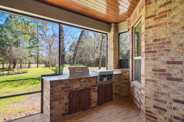 33922 High Point Dr, Magnolia, TX 77355 - unfurnished sunroom with area for grilling and view of scattered trees