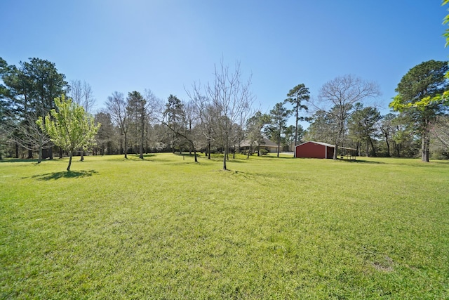 33922 High Point Dr, Magnolia, TX 77355 - view of green lawn featuring an outbuilding and a pole building