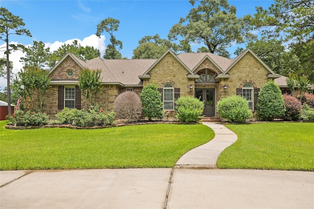 33922 High Point Dr, Magnolia, TX 77355 - view of front of home featuring stone siding and a front lawn
