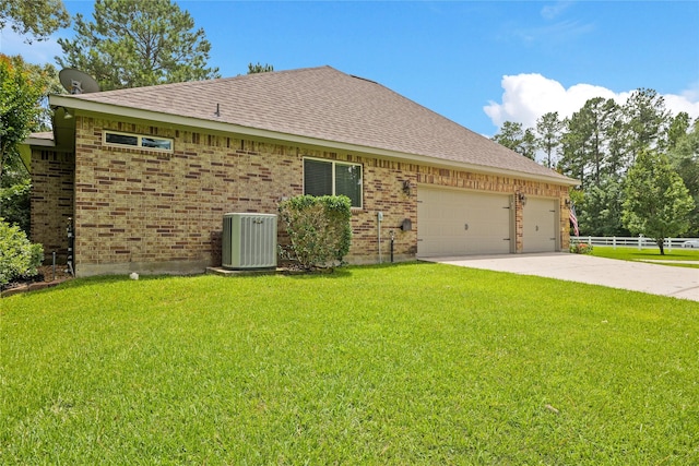33922 High Point Dr, Magnolia, TX 77355 - rear view of property with an attached garage, concrete driveway, roof with shingles, and brick siding