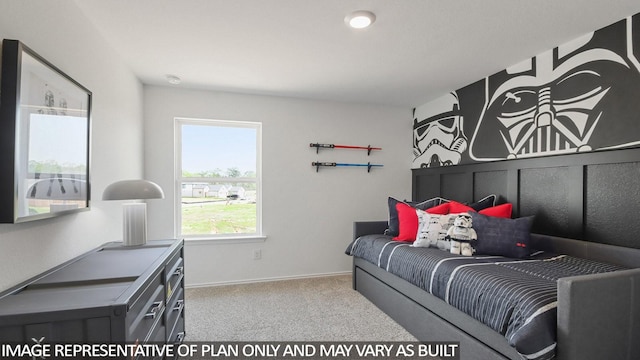 carpeted bedroom featuring baseboards