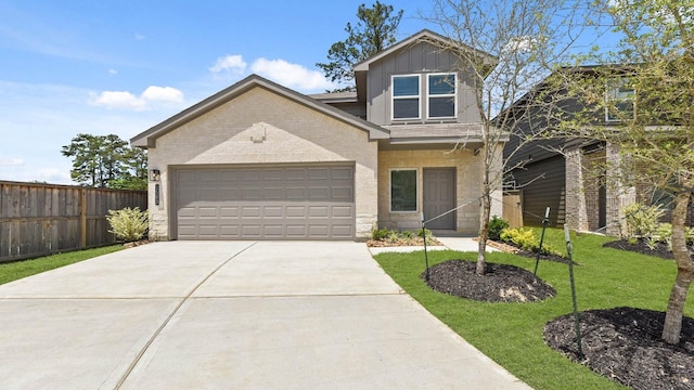 1503 Portia Ct, Conroe, TX 77301 - view of front of home featuring driveway, brick siding, an attached garage, and board and batten siding