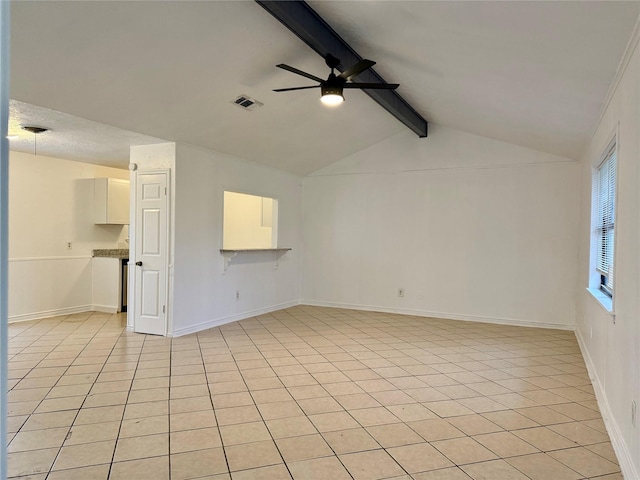 spare room with lofted ceiling with beams, baseboards, visible vents, a ceiling fan, and light tile patterned floors