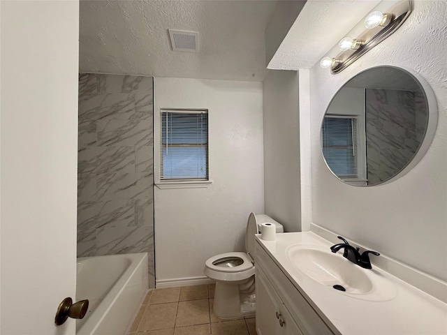 bathroom featuring tile patterned floors, a textured ceiling, vanity, toilet, and visible vents