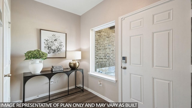 entrance foyer with baseboards and dark wood-style floors
