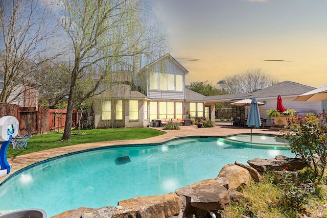 1906 Blue Water Bay Dr, Katy, TX 77494 - view of pool with fence, a patio, a water slide, a fenced in pool, and a lawn