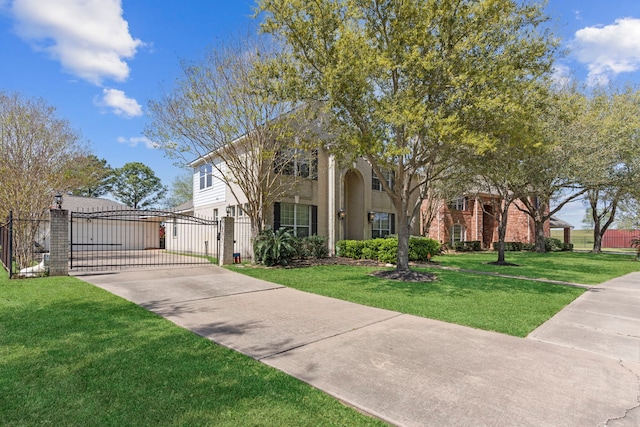 1906 Blue Water Bay Dr, Katy, TX 77494 - view of front of home featuring fence, driveway, a front yard, a gate, and brick siding