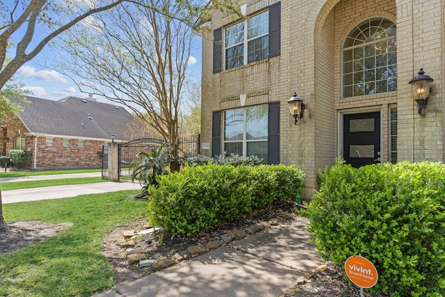 1906 Blue Water Bay Dr, Katy, TX 77494 - view of exterior entry featuring brick siding and a gate