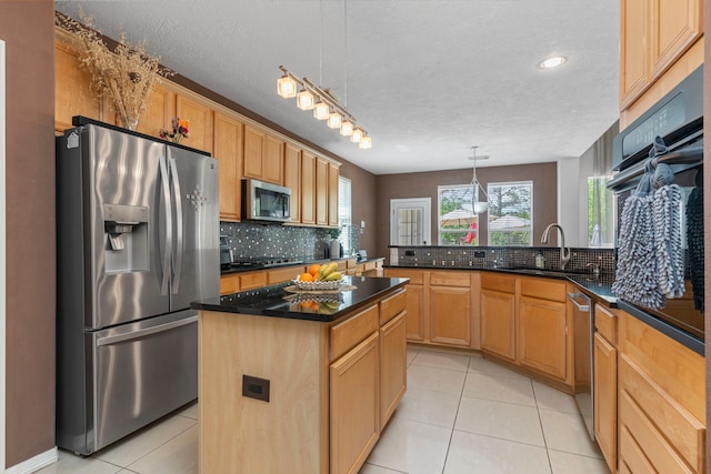 1906 Blue Water Bay Dr, Katy, TX 77494 - kitchen with a sink, light tile patterned floors, stainless steel appliances, decorative light fixtures, and decorative backsplash