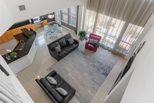 1906 Blue Water Bay Dr, Katy, TX 77494 - tiled living area featuring a healthy amount of sunlight and visible vents