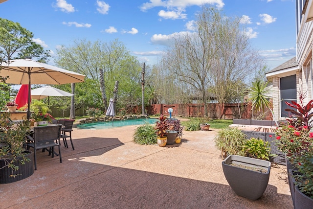 1906 Blue Water Bay Dr, Katy, TX 77494 - view of patio with a fenced backyard, a fenced in pool, and outdoor dining area