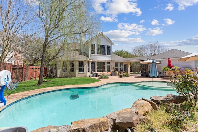 1906 Blue Water Bay Dr, Katy, TX 77494 - view of swimming pool featuring a fenced backyard, a water slide, a fenced in pool, a patio area, and a lawn