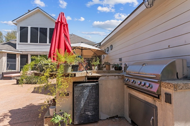 1906 Blue Water Bay Dr, Katy, TX 77494 - view of patio / terrace featuring grilling area and exterior kitchen