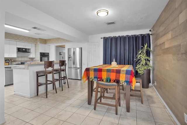 1725 Strawn Rd, Houston, TX 77039 - dining area with light tile patterned floors
