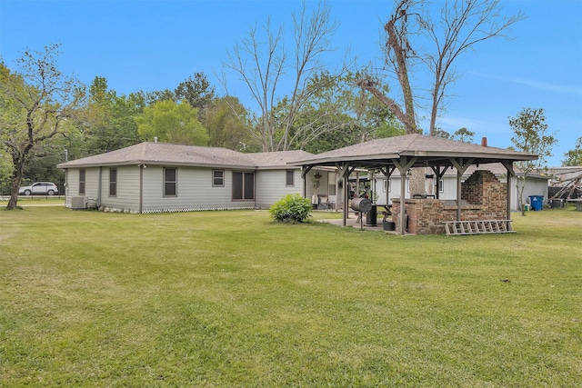 1725 Strawn Rd, Houston, TX 77039 - back of house featuring a gazebo, a lawn, cooling unit, and a patio