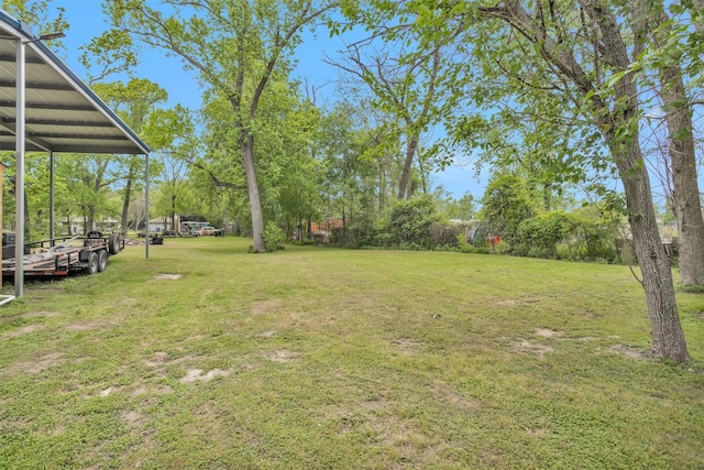 1725 Strawn Rd, Houston, TX 77039 - view of green lawn featuring view of wooded area