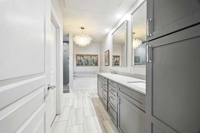3333 Allen Pkwy Unit 701, Houston, TX 77019 - bathroom featuring a chandelier, a tub to relax in, double vanity, a shower, and recessed lighting