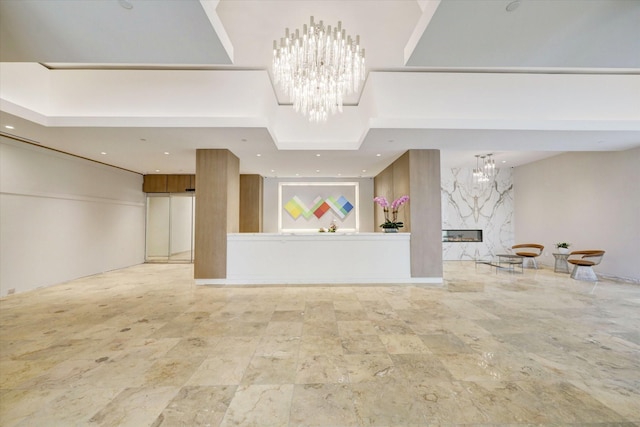 3333 Allen Pkwy Unit 701, Houston, TX 77019 - reception area featuring a chandelier, a premium fireplace, and recessed lighting