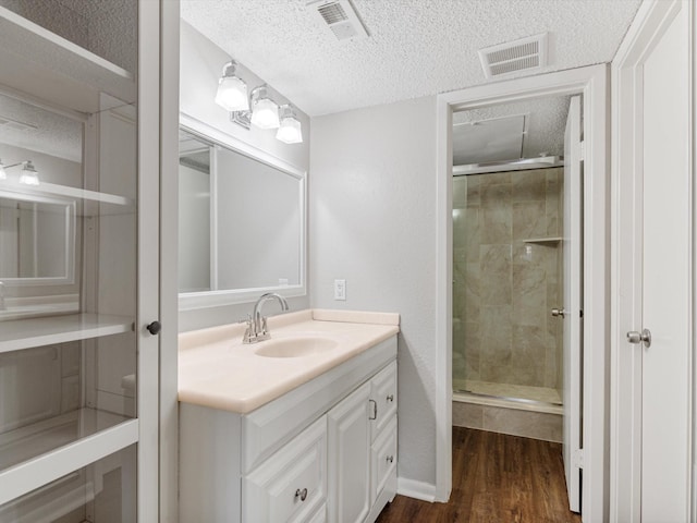 2800 Jeanetta St Unit 2803, Houston, TX 77063 - full bath featuring vanity, a textured ceiling, visible vents, and a shower stall