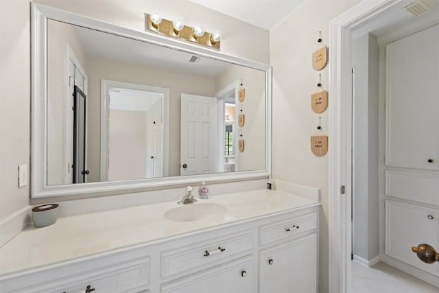 bathroom featuring vanity and visible vents